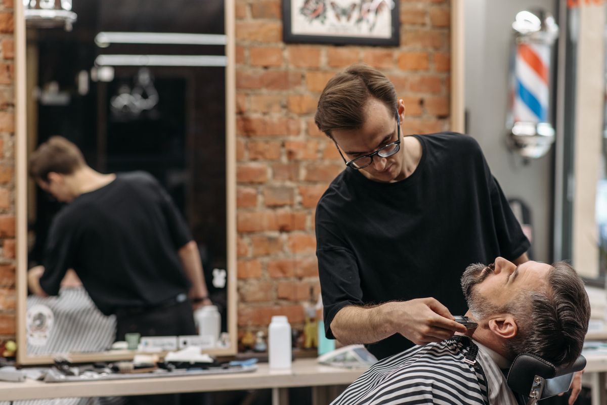 Barber doing precision detail work